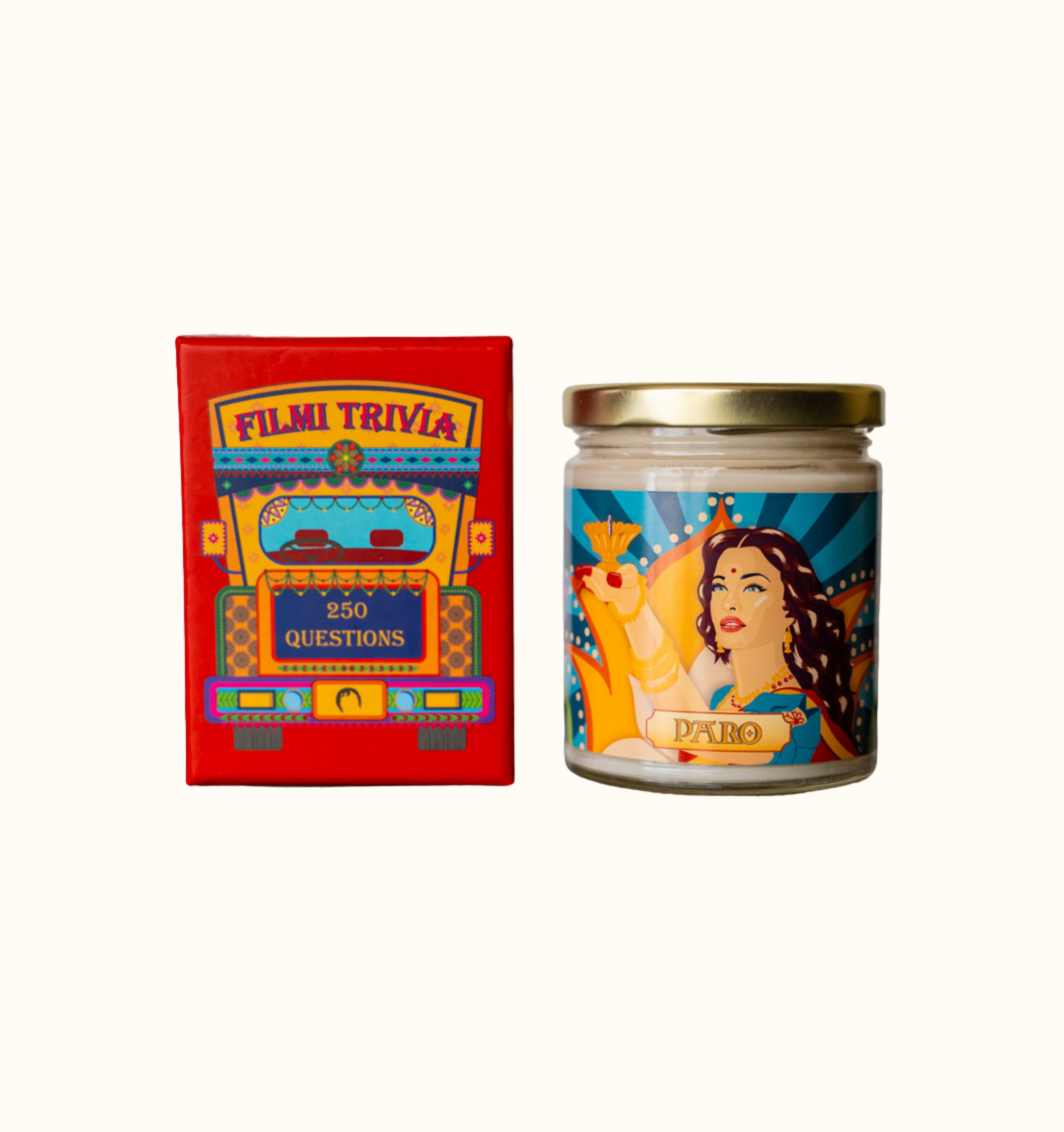 Diwali gift set bundle featuring Filmi Trivia, a Bollywood Trivia card game, and the Paro Candle, a chai scented candle with artwork of Paro played by Aishwarya Rai in the Bollywood movie Devdas holding a diya.