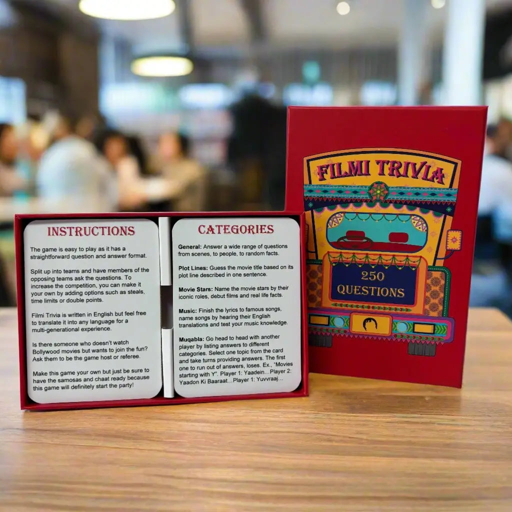 A deck of Filmi Trivia, a Bollywood themed trivia card game, on a table.