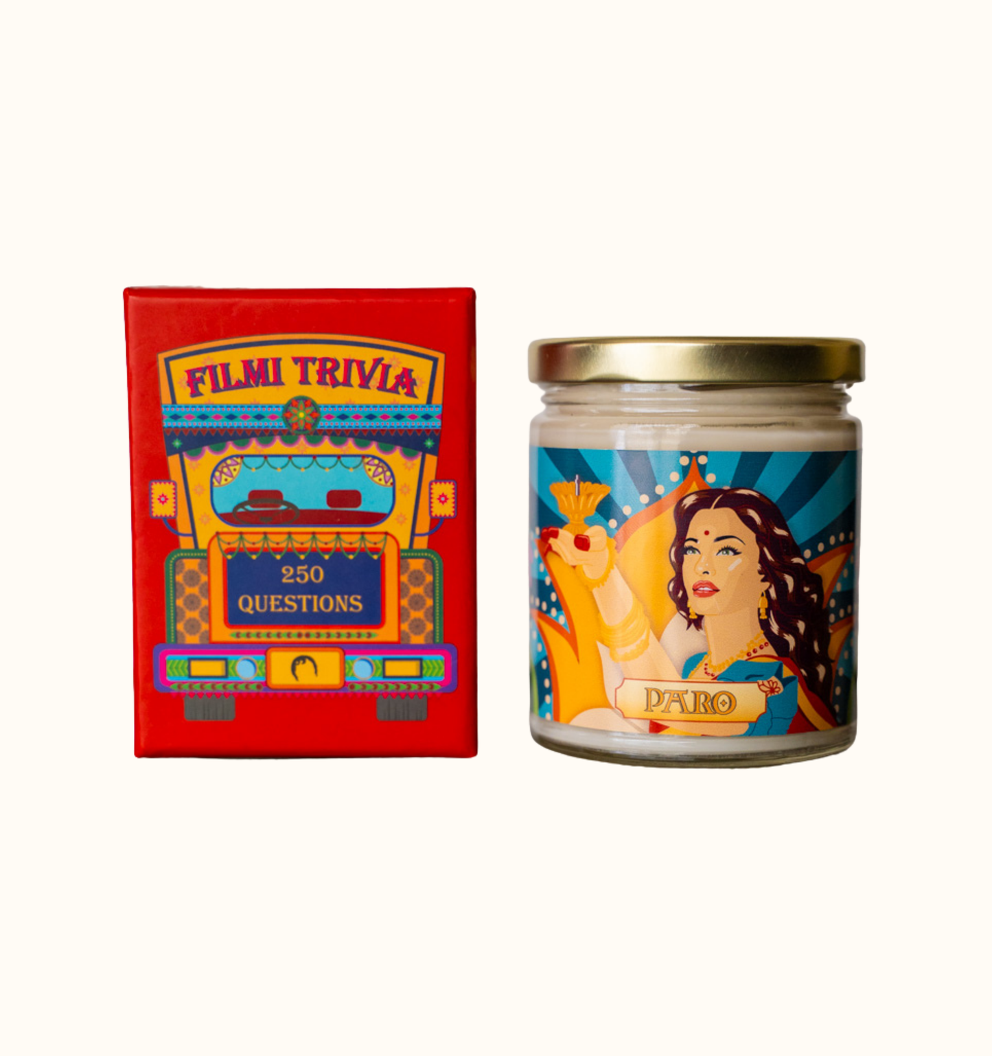 Diwali gift set bundle featuring Filmi Trivia, a Bollywood Trivia card game, and the Paro Candle, a chai scented candle with artwork of Paro played by Aishwarya Rai in the Bollywood movie Devdas holding a diya.