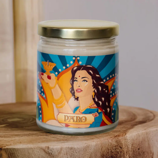 Paro Candle, a chai scented candle with artwork featuring Paro, played by Aishwarya Rai in the Bollywood movie Devdas, holding a diya.