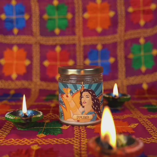 Filmi Trivia, a Bollywood themed Trivia card game, and the Paro Candle, a chai scented candle with artwork featuring Paro played by Aishwarya Rai in the Bollywood movie Devdas. Text says "This Diwali give the gift of light and fun".